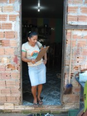 Maria Júlia taking inventory